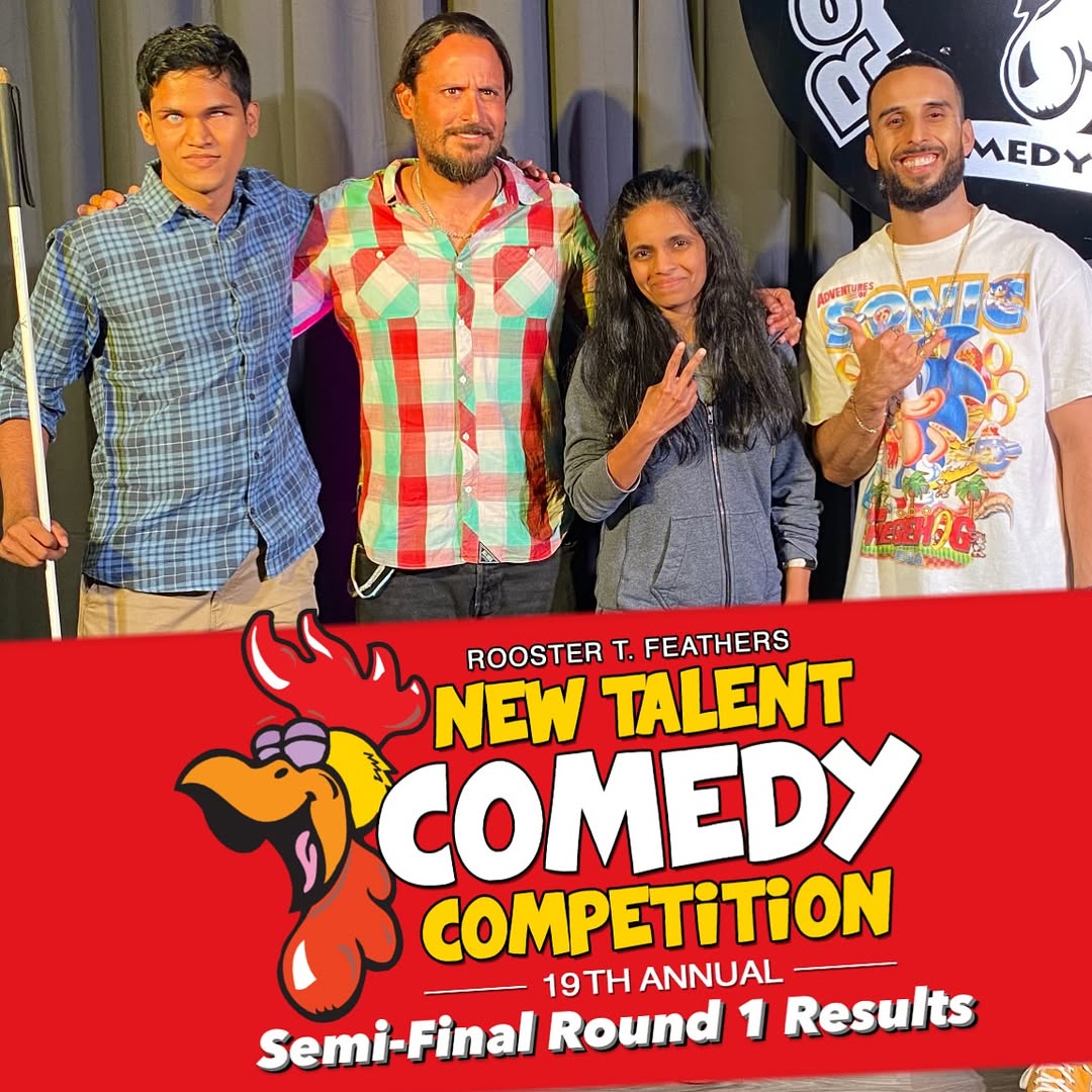 Bhavya and three other comics pose on stage with a red banner below them reading: Rooster T. Feathers New Talent Comedy Competition – 19th Annual Semi-Final Round 1 Results